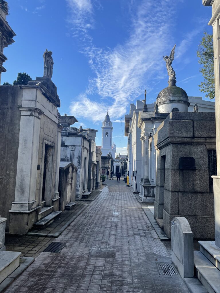 Small clouds over a row of mausoleums at the famous Argentina cemetery